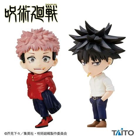 Two Anime Figurines With Black Hair And Red Shirt