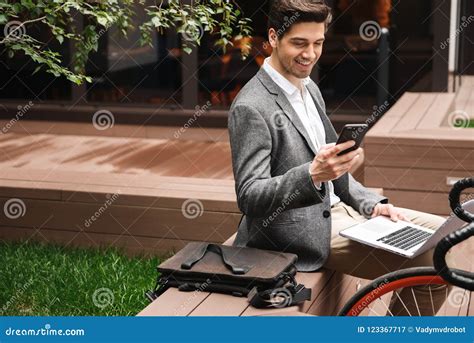 Smiling Young Businessman Using Mobile Phone Stock Image Image Of