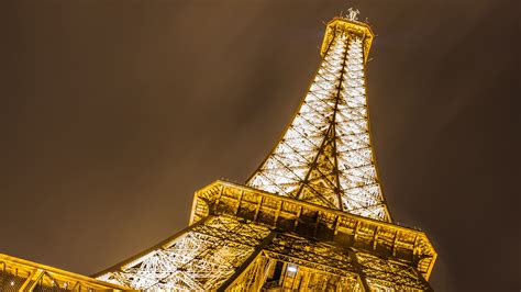 Upward View Of Paris Eiffel With Yellow And White Lightings Tower 4k Hd