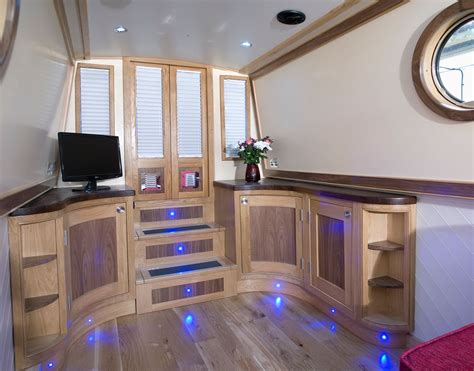 A Room With Wood Floors And Wooden Cabinets Blue Lights On The Floor