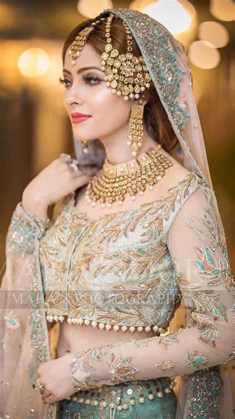 Pakistani Bride Wearing Designer Jewelry And Lehenga Choli At Her