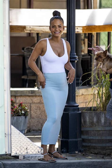 Christina Milian Wears A White Tank Top And Baby Blue Skirt While Hanging Out At Her Beignet Box