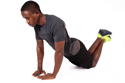 African Man Doing Diamond Push Ups On His Knees High Quality Free Stock Images