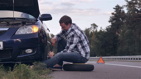Man Stuck On Side Of Road With Flat Tire Stock Footage Sbv