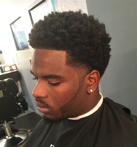 This taper fade is one of the most preferred among caucasian males as it embraces both curly hair and edgy trims. Taper fade haircut by (Zay The Barber) Afro Ghost Beard ...