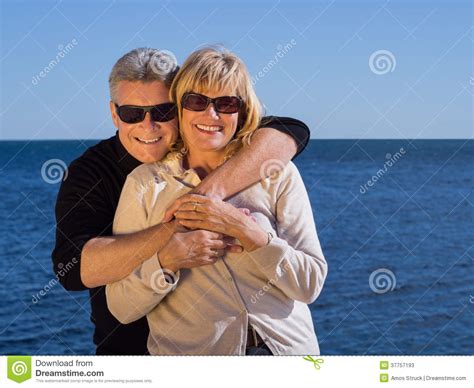 Laughing Romantic Mature Couple Enjoy A Day At The Sea Stock Image Image Of Holding Portrait