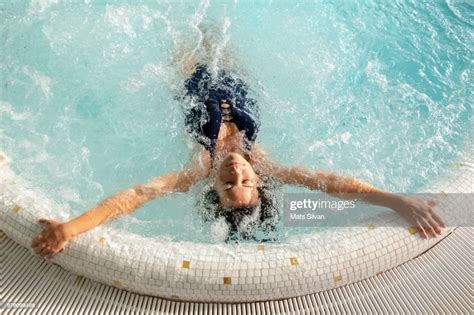Woman Relaxing In A Hydro Massage Pool Photo Getty Images