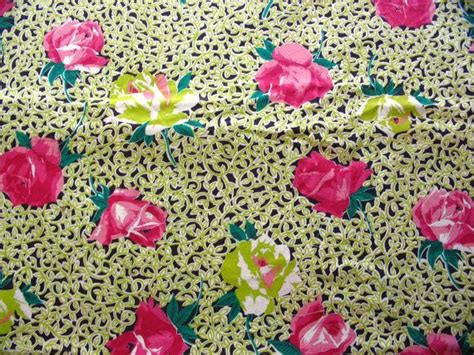 The Fabric Has Pink And Green Flowers On It