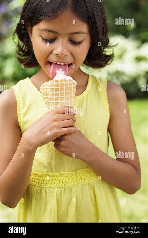 girl eating ice cream cone photo stock alamy