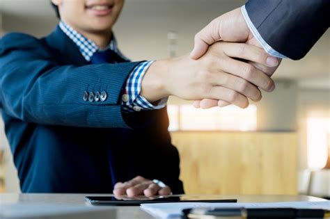 Two Confident Business Man Shaking Hands During A Meeting In The Office