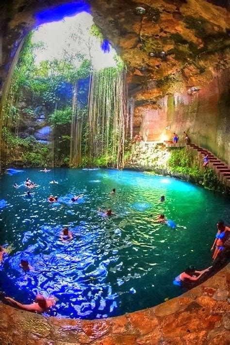 People Swimming In The Cave Cenote Ik Kil In Yucatan Mexico Located In