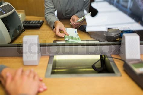 Clerk Giving Cash Money To Customer At Bank Office Stock Image