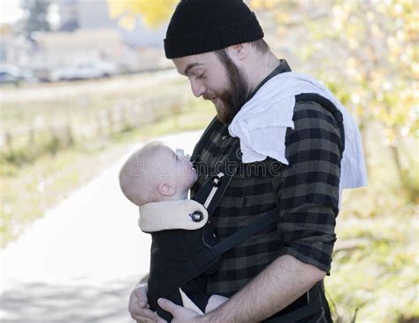Millennial Dad With Baby In Carrier Outside Walking Stock Image Image