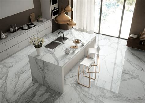 The white is offset with stainless steel countertops and warm, light wood flooring. Marble Interior Trends for Luxurious Home Interior Purpose ...