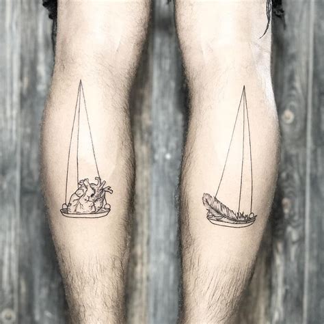 Most relevant best selling latest uploads. Scales tattoo on both legs: weighing heart and feather ...