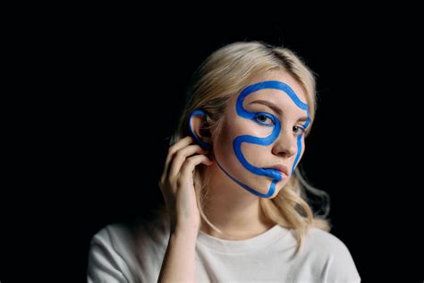 Portrait Photo Of Woman With Blue Face Paint · Free Stock Photo