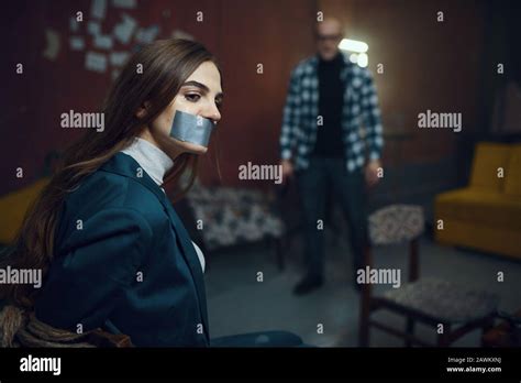 Maniac Kidnapper And Victim With Taped Mouth Shut Stock Photo Alamy