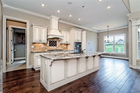 Open Floor Plan Featuring Antiqued White Cabinets Bianco
