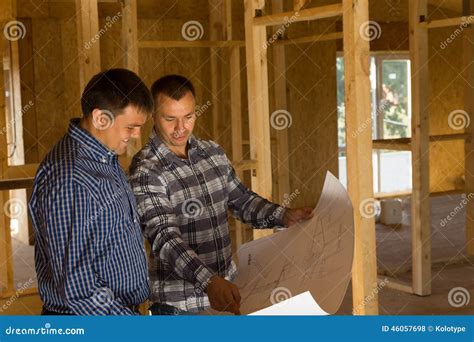 Two Builders Inside A Half Completed House Stock Photo Image Of