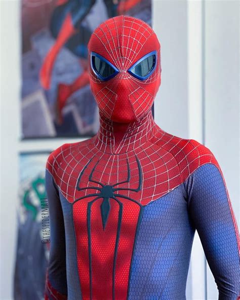 A Close Up Of A Person Wearing A Spider Man Costume