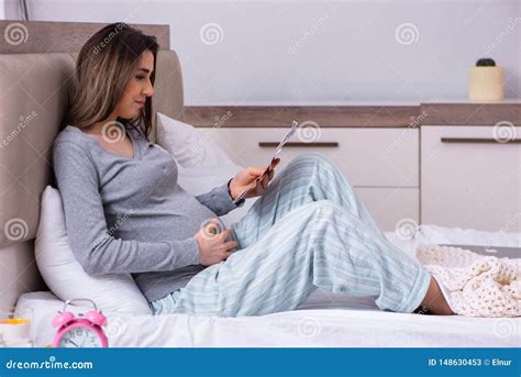 Young Pregnant Woman In The Bedroom Stock Image Image Of Expectant Belly 148630453