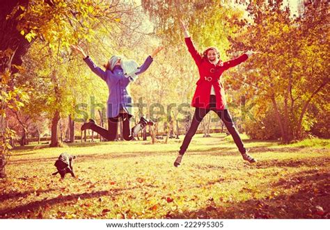 Happy Women Jumping Outside Autumn Fall Stock Photo Edit Now 222995305