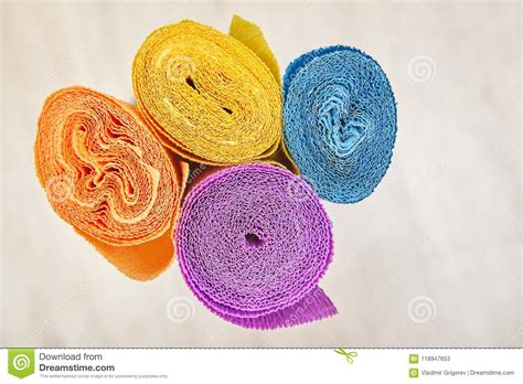 Corrugated Wrapping Paper Is Twisted Into Four Colored Rolls Stock