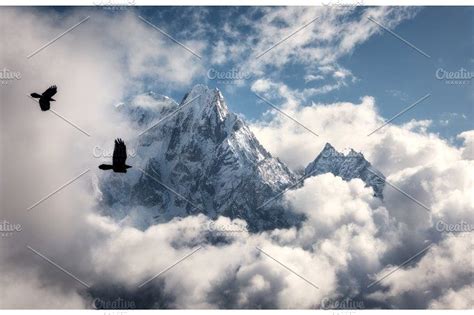 Flying Birds Against Majestical Manaslu Mountain With Snowy Peak By Den