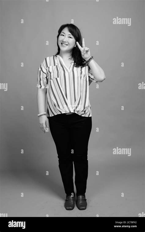 Full Body Shot Of Mature Beautiful Asian Businesswoman Stock Photo Alamy