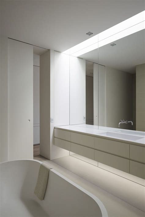 First, a bathroom vanity will generally have a light mounted somewhere above the with your dry fit complete and your mirror's precise destination marked on the wall, it's time to put the mastic onto the back of your mirror. Bathroom Mirror Ideas - Fill The Whole Wall | Bathroom ...