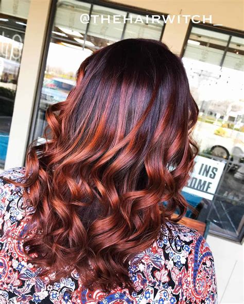 If you want the copper color to stand out and do the talking, request that your hairdresser takes the highlights up to your roots. dark brown hair with copper highlights - All About The Gloss