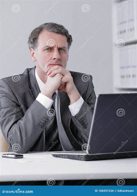 Businessman Sitting At The Desk In Office Workplace Stock Photo Image