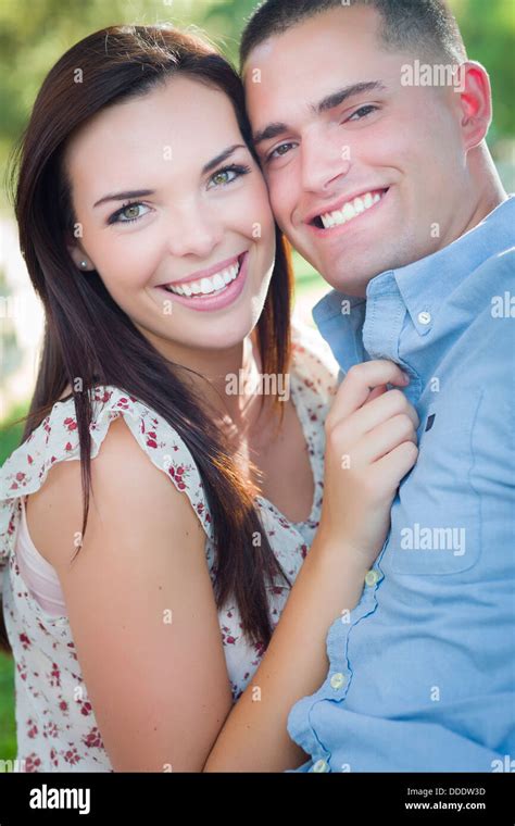Happy Mixed Race Romantic Couple Portrait In The Park Stock Photo Alamy