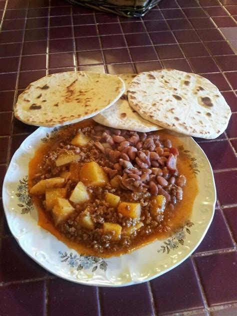 Pinto chili beans with hamburger excel! Mexican dish, potatoes with hamburger meat cooked with ...
