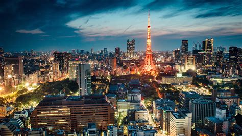 tokyo tower with light during nighttime in japan hd travel wallpapers hd wallpapers id 47786