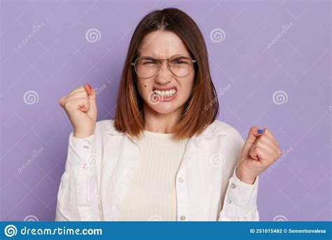 Image Of Angry Aggressive Dark Haired Woman Wearing White Shirt