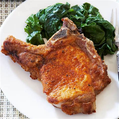 After 30 minutes, use a paper towel to pat the pork chops dry then rub both sides of the chops with the spice rub. Pan-Fried Pork Chops | Cook's Country