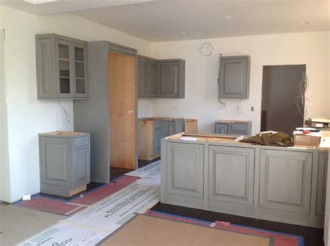 The most important thing is that it will make the room seems too yellow. Room color for gray kitchen cabinets