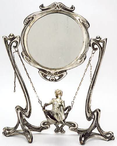 A Silvered Bronze Figural Vanity Mirror In The Art Nouveau Taste The Circular Mirror On Frame