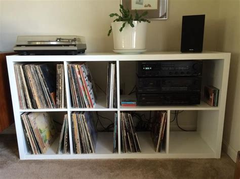 An Entertainment Center With Various Records And Audio Equipment