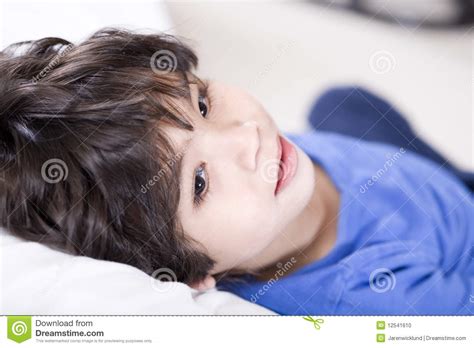 Handsome Little Boy Resting Quietly Stock Photo - Image of serious ...