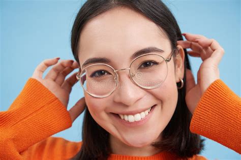 Close Up Portrait Of Beautiful Young Asian Woman In Glasses Smiling