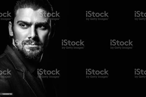 Black And White Male Portrait A Man In A Black Classic Suit In A Black
