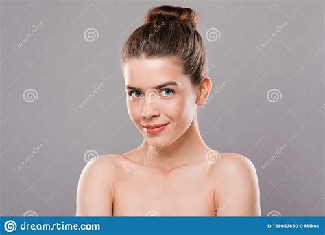 Closeup Of Nude Young Model Posing Over Grey Background