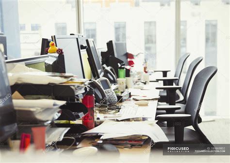 Messy Row Of Desks In Modern Office — Technology Empty Stock Photo