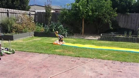 Guy Flies Off Rooftop Slip N Slide And Flies Over Inflatable Pool Jukin Media Inc