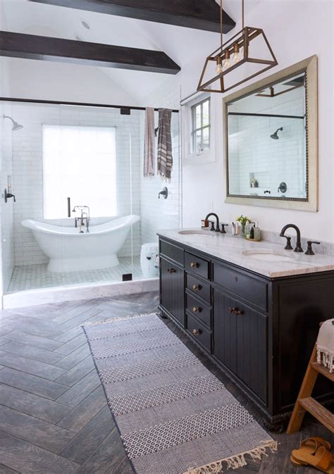 Modern farmhouse flooring done in a black and white patterned tile makes a statement in this farmhouse bathroom. Modern-farmhouse-minimal-master-bathroom---double-slipper ...