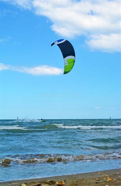 Young Man Ride Kite Surf In The Sea Extreme Sport Kitesurfing Or