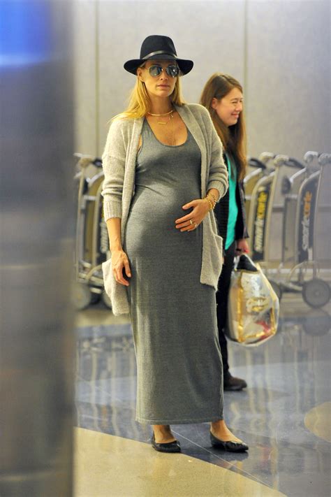 Pregnant Molly Sims At Los Angeles International Airport
