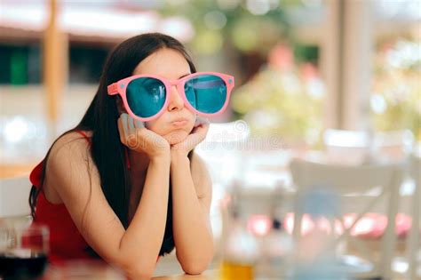 Bored Woman With Funny Big Party Glasses Having No Fun Stock Photo